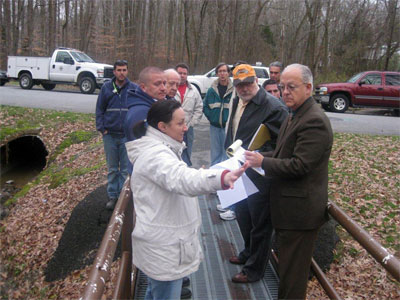 Residents of Devon and Devonshire meet in the park that sits in the heart of their Brandywine Hundred communities to discuss maintenance issues with New Castle County park workers.